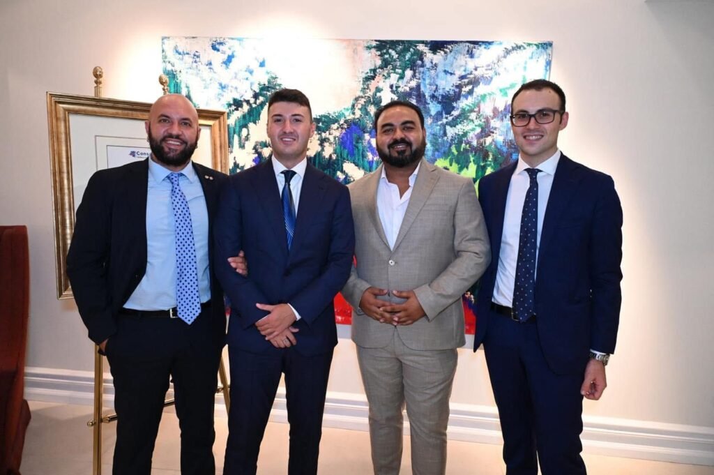 Dr. Waqas Nadeem and Andrea Gentilini with international delegates at the Global Business and Diplomacy Forum in Italy, discussing global cooperation, humanitarian development, and trade partnerships.